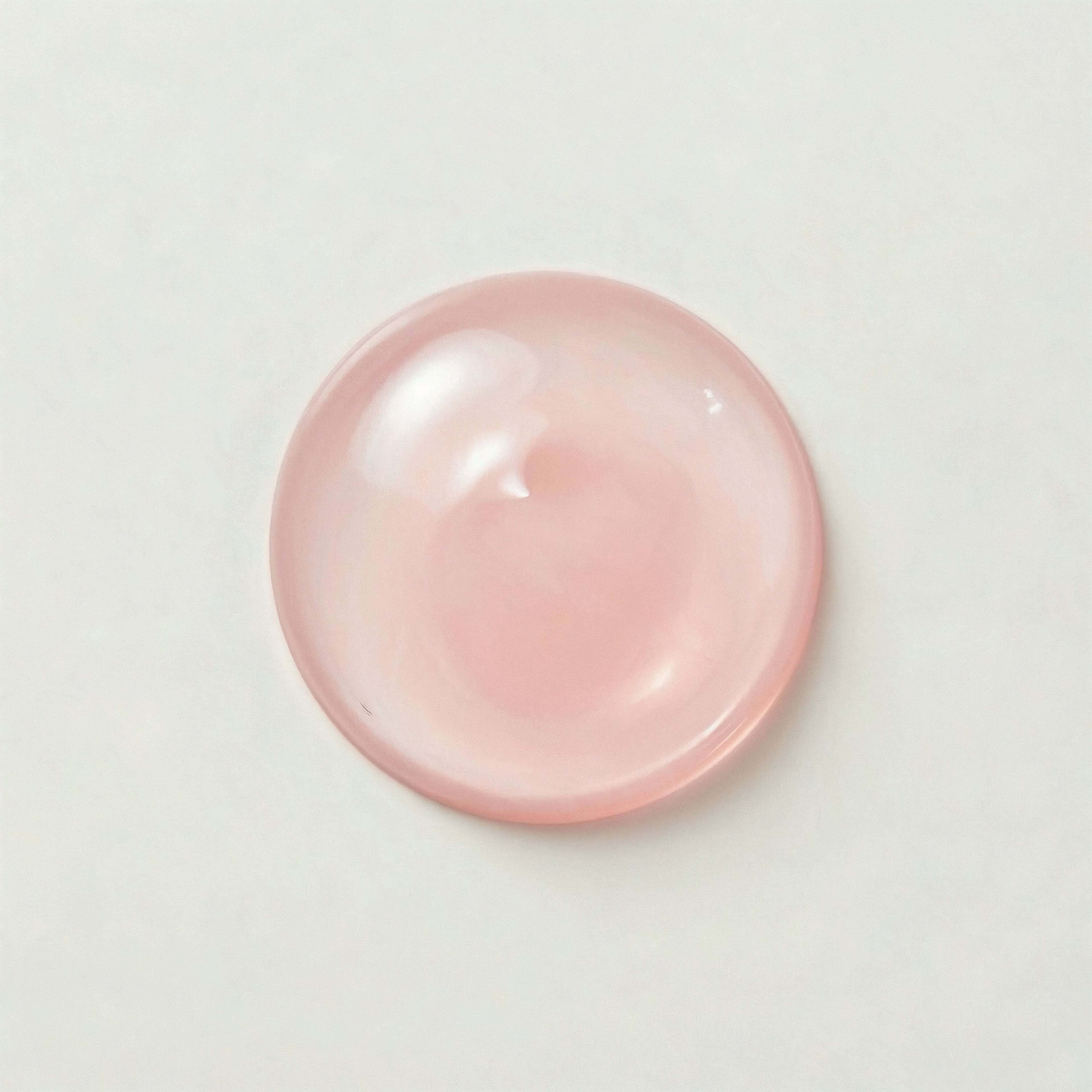 Pink serum on a light gray background